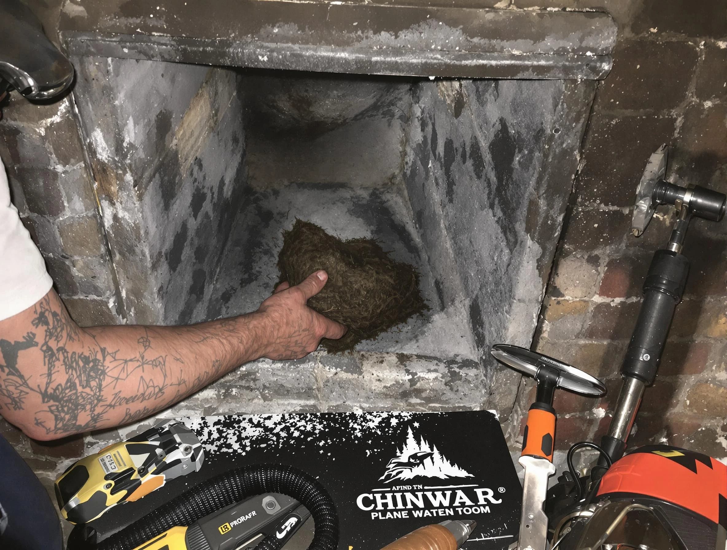 Shawnee Chimney Sweep safely removing debris and screening chimney in Shawnee, OK